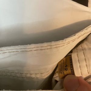 Mens True Religion cargo shorts. Size 42. White w/ tan stitching. Used.